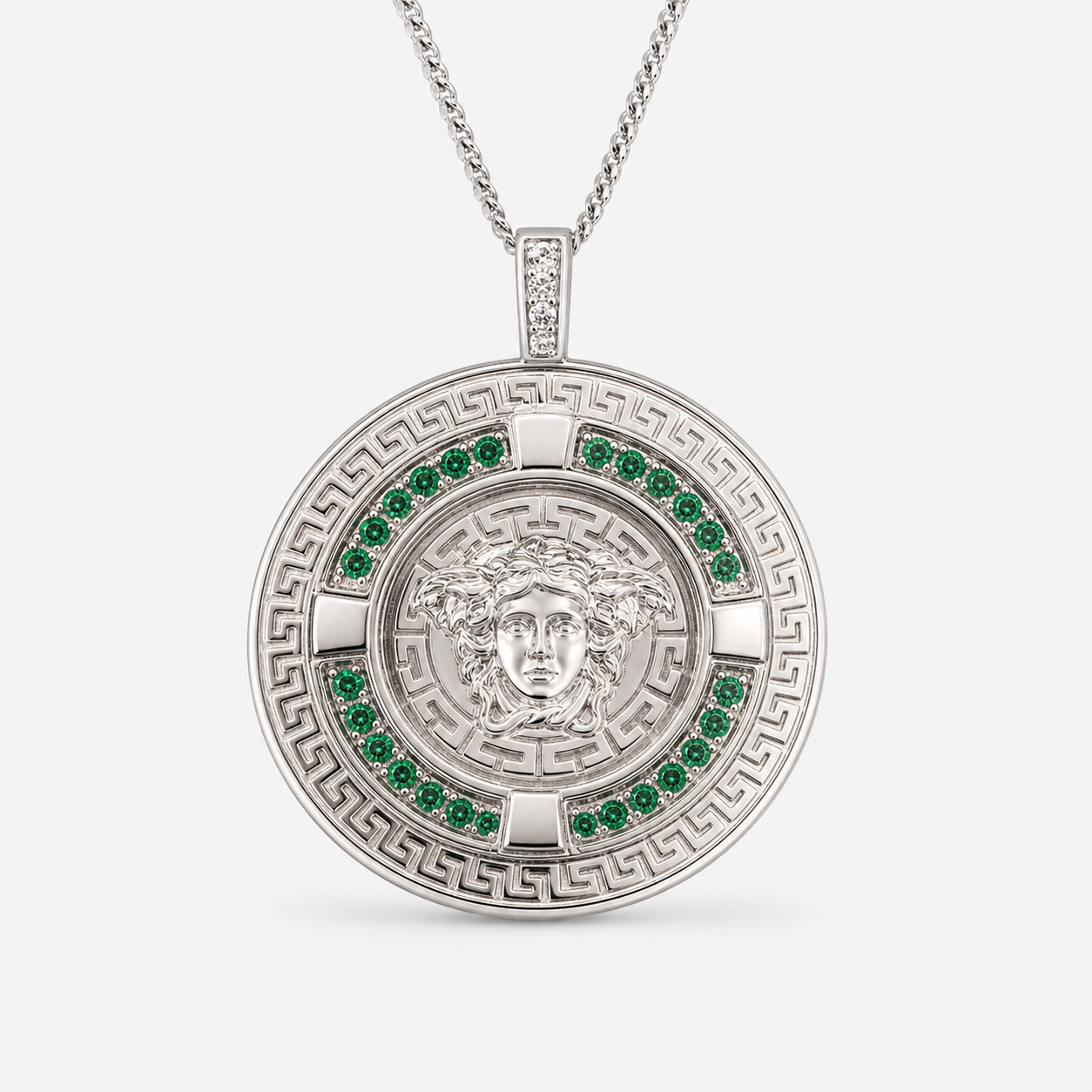 Professional studio product photo of Greek Key Mythology Medusa Pendant Green CZ Stones + Sterling Silver Chain on white background