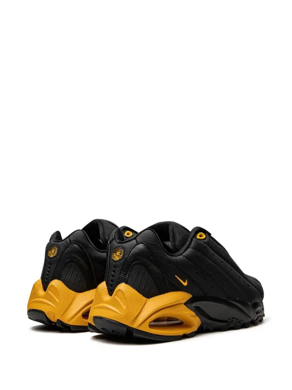 NOCTA x Nike Hot Step Air Terra 'Black University Gold'